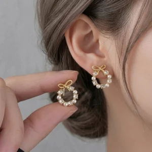 pearl gold bow earrings